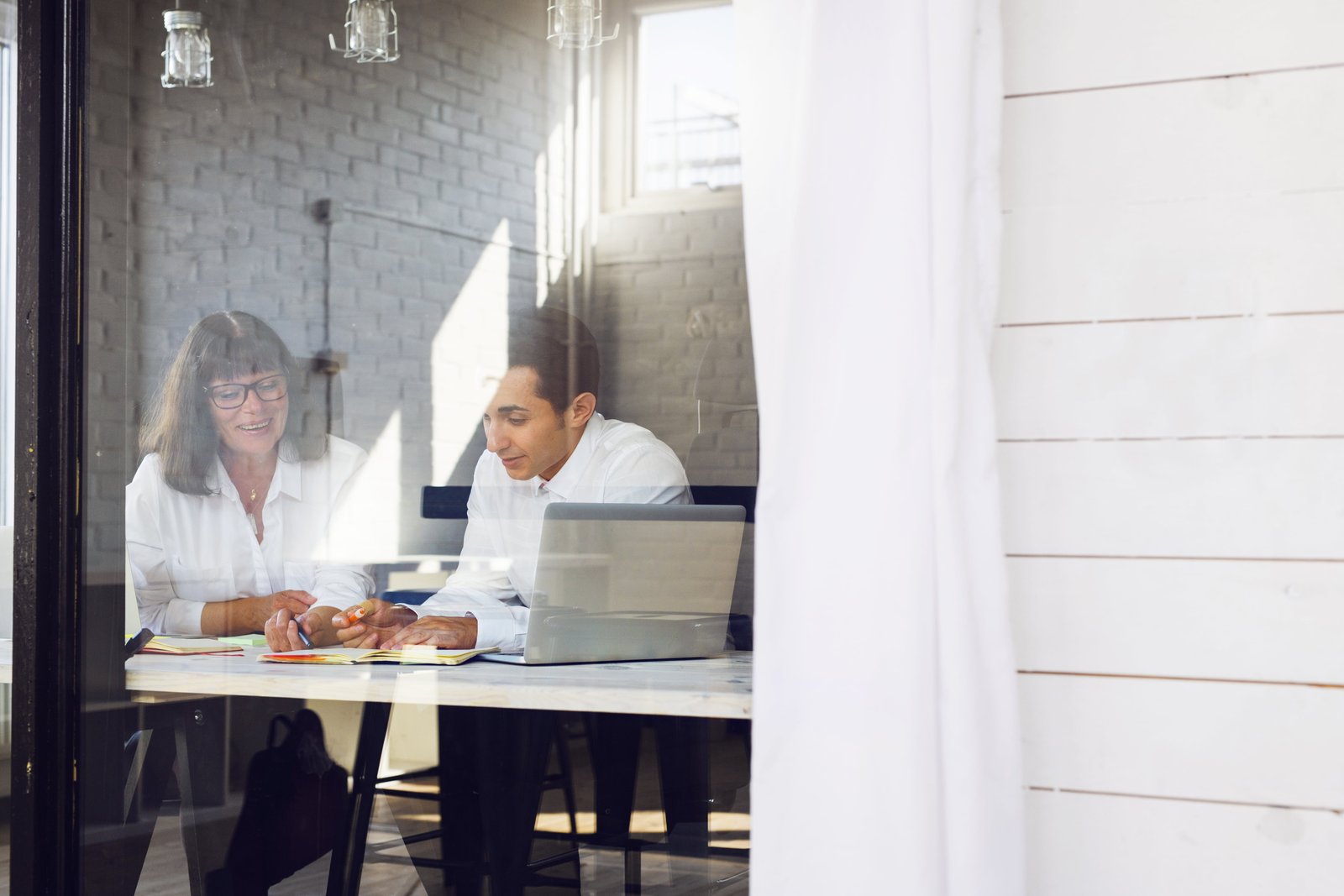 Woman and man working in office